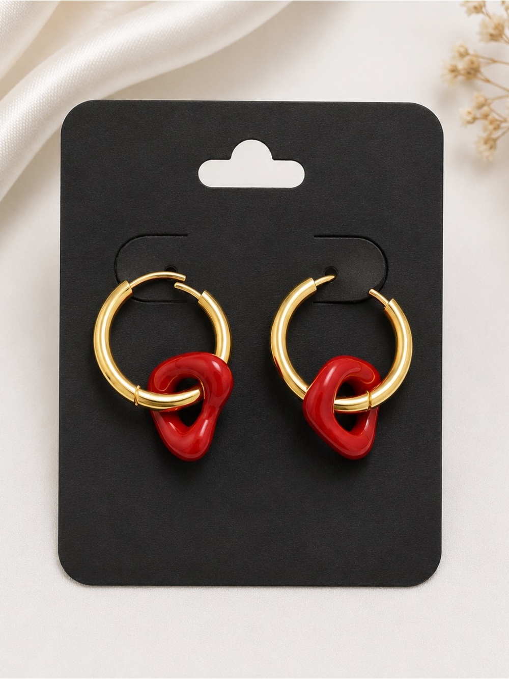 Gold Hoop Earrings with Red Resin Knot Accent